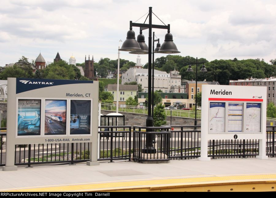 Dual Amtrak/ CT Rail signs on the station platform.